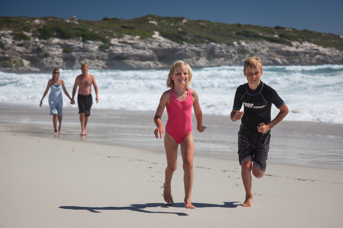 Family with kids on the beach