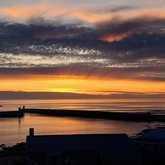 Sunset Over Gansbaai Harbour - 49 on Cliff - Xplorio™ Gansbaai