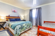 greyton_accommodation_grown_ups_getaway_guest_house_walk_though_bedroom_top_floor_copy_2_1748330412