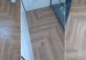 Stylish Herringbone Flooring Installed in Small Bathroom