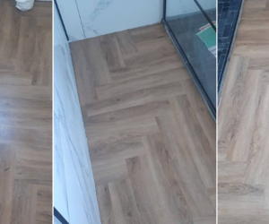 Stylish Herringbone Flooring Installed in Small Bathroom