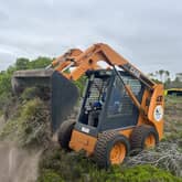 Large skid steer/Bobcat used for debris removal