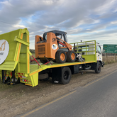 Beavertail truck used to transport equipment