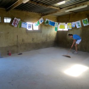Clayden Burger preparing the concrete before painting