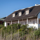 Beautiful thatch-roof houses next to the lagoon