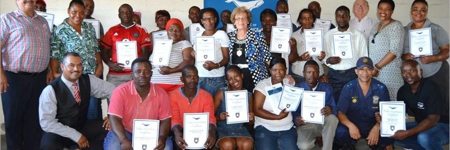 Seen at a recent graduation awards ceremony in Maskhane, Gansbaai were Overstrand Mayor, Nicolette Botha-Guthrie (pictured centre), along with municipal officials and Councillors and members of the Masakhane Street Committee, who proudly showed off their certificates received for completing a course on Municipal By-Law Enforcement in November 2015.