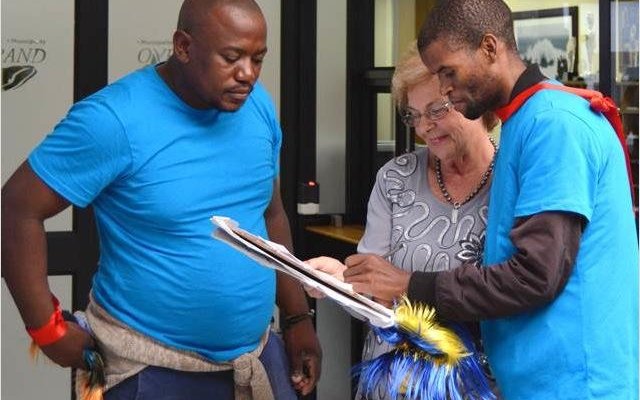 Executive Mayor Nicolette Botha-Guthrie (centre) receiving a “Memorandum of Awareness and Support” petition  from Siyabonga Vonco (right) and Mziwamakhosi Yiko-Skosana (left) of The Hermanus Rainbow Trust community development organisation. 