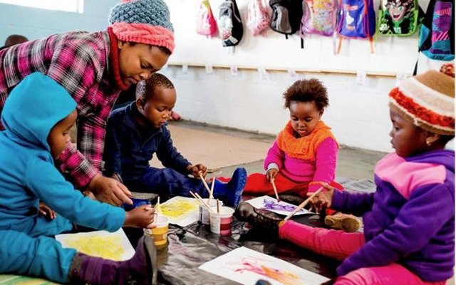 Children painting at Flower Valley Early Learning Centre
