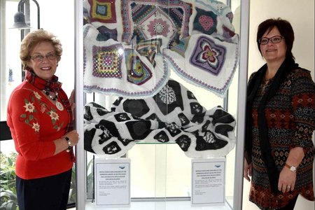 The spectacular multicoloured and black and white blankets that have been crocheted by Estrellita Engelbrecht and Jane Langenhoven and their respective teams of ladies from the “Hooked on Tuesday” Club are currently  on  display in the glass cabinet in front of the Hermanus Library. For those wanting to partake, raffle tickets are available at the Hermanus Library at a cost of R50 each for the multi-coloured blanket and R30 each for the black and white one.  Executive Mayor Nicolette Botha-Guthrie and Councillors’ Secretary Doret Taljaard pictured with the two specially handcrafted crocheted blankets that will be raffled to raise funds for various projects under the banner of the Nicolette Botha-Guthrie Charity Fund. 