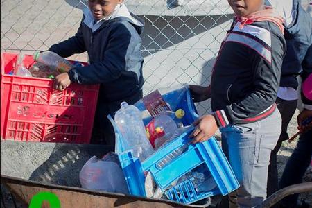 Masakhane children bring their recyclables to the Recycle Swop Shop in bags, crates, wheelbarrows or anything else they can manage.