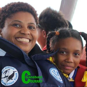 Pinkey Ngewu, organiser of the competition, on Dream Catcher during the boat trip for the competition winners, with Dederei Johnson next to her.