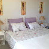 Spacious main bedroom with king size bed has an en suite bathroom