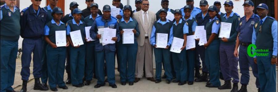 Director of Protection Services, Neville Michaels (centre) was recently pictured at a certificate handover ceremony where Law Enforcement officials were awarded certificates for completing courses in Fire Arms Training, Security and Skipper’s License.