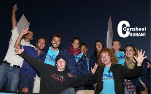 The final count down … 3, 2, 1 – and the town’s Christmas Lights were switched on.  Above are voluntary workers from Marine Dynamics making the most of this festive event in Gansbaai.  They were part  of  the  procession  through the streets.  These  young  people  represent countries from all over the world.