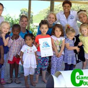 The intro class of Hermanus Montessori Private School raised R600 for African penguins and also learned a lot about them. Left is their teacher, Loren Augus and right is Pinkey Ngewu from Dyer Island Conservation Trust.