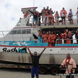 The actor and comedian, Tracy Morgan shows his excitement about the  forthcoming shark diving trip in front of the boat “Slashfin”. His brother, Jim (right) joined him.