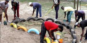 A team from Grootbos Foundation’s Food Security project busy to beautify  Strandlopertjie for their  television appearance this week.  In front is Anchelle Damon, from the Grootbos Early Chilhood Development Programme, with - from left:  Pontsho Chiloane, Vuyo Khonkco, Olwethu Sikhotshi, Lindile Xabenolini, Odwa Khutshwa, Zuko Mlonyeni and Luyanda Pinikiso. 