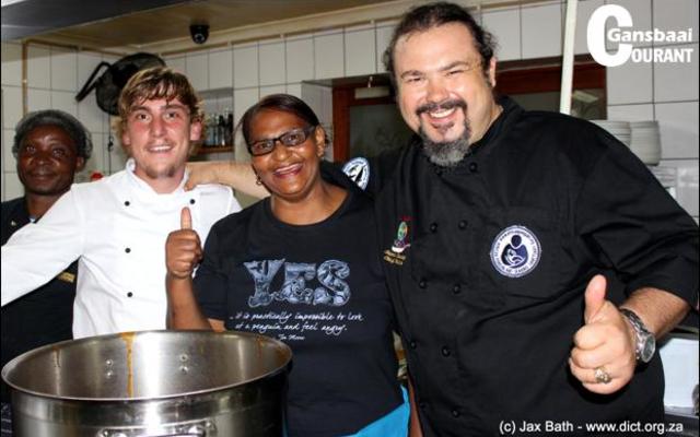 Shane Sauvage (right) of the famous restaurant, La Pentola, is in action at the African Penguin and Seabird Sanctuary fundraiser in April 2016 with some of the Great White House staff members.