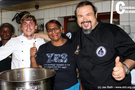 Shane Sauvage (right) of the famous restaurant, La Pentola, is in action at the African Penguin and Seabird Sanctuary fundraiser in April 2016 with some of the Great White House staff members.