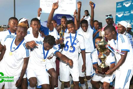 Stanford Young Tigers FC pump their fists in the air in exultation and hold the winning trophy and cheque aloft with great pride after being crowned the undisputed winners in Saturday’s soccer grand finale.