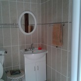 Unit 2: Bathroom with shower and hand basin.