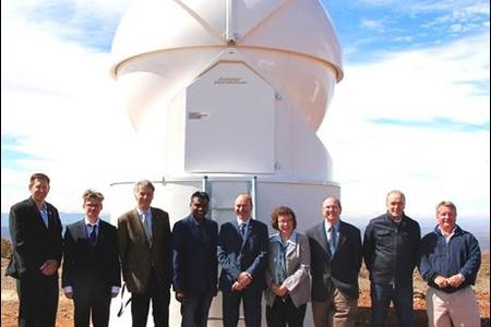 Roll players and the SANSA team in front of the space debris tracking telescope which was unveiled at the Optical Space Research (OSR) Laboratory in Sutherland. 