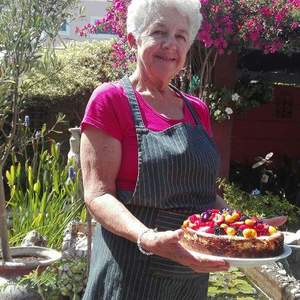 Gayle with her freshly baked berry cheese cake.