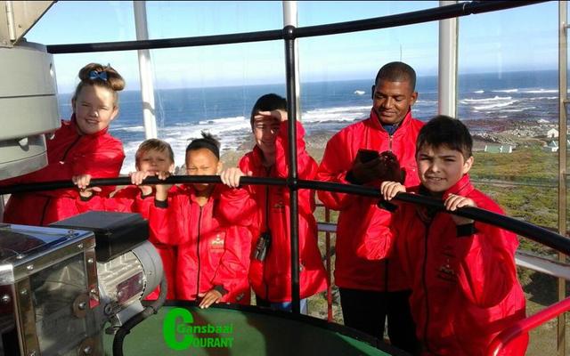 An  excited  group  of Paul Greyling Primary School’s learners in the top part of Dangerpoint Lighthouse.