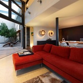 The living room with sliding door, direct acces to the pool