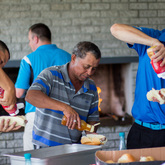 Club members making hot dogs