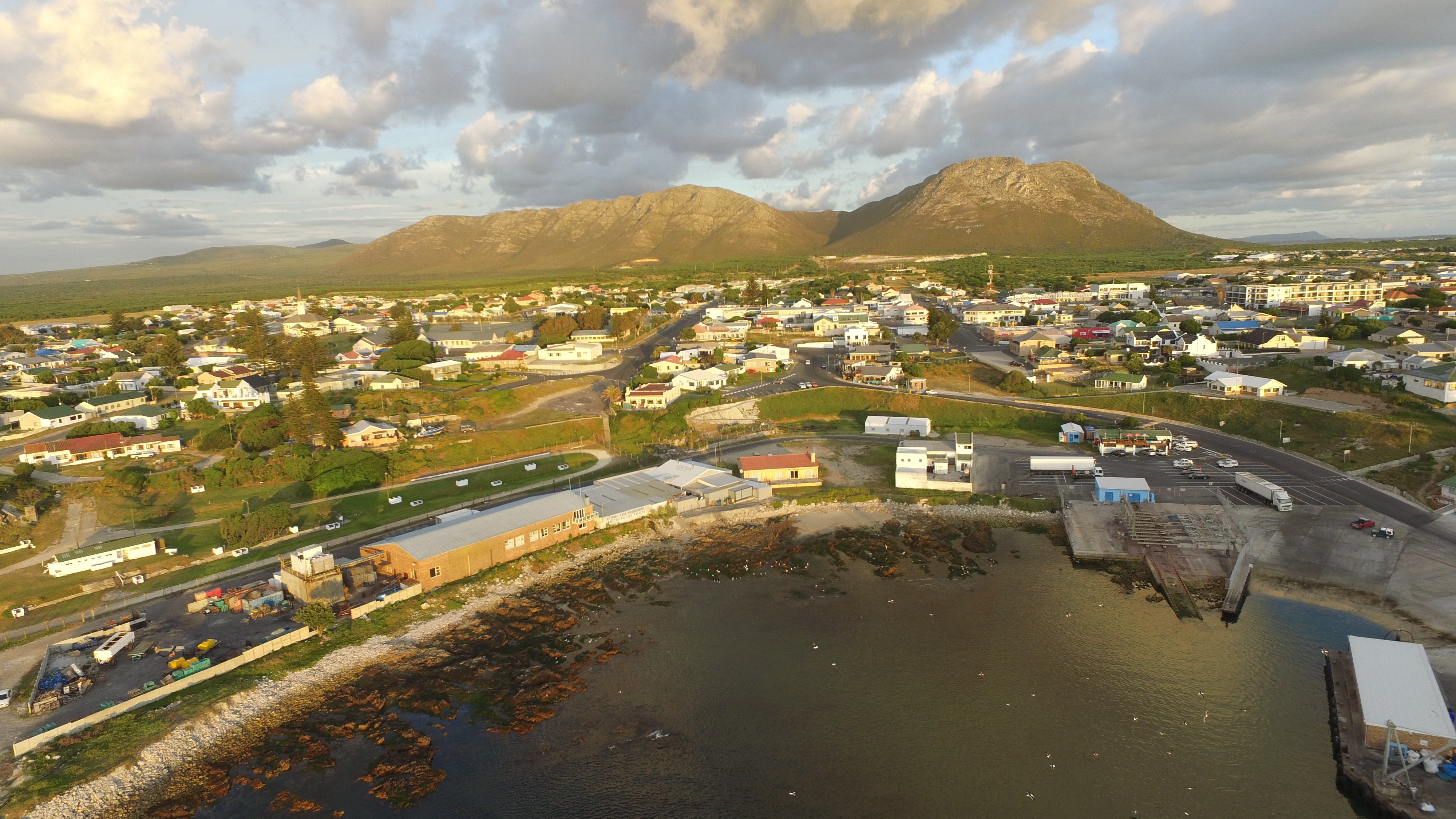 Gansbaai harbour and mountains 