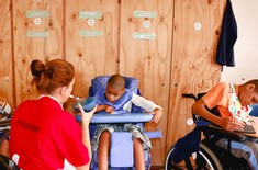 Elim_home_volunteer_feeding_child_1518417993