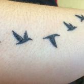 Birds flying tattoo