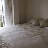 The downstairs guest room has a king-sized bed that can be split into two full-sized beds, a large closet/wardrobe and a private balcony