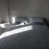 The upstairs guest room has an en suite half-bath, spacious closet/wardrobe and french doors leading on to its balcony