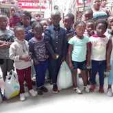 Some of the 95 children who received school clothes.