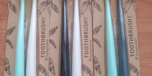 Toothbrush sets with biodegradable handle