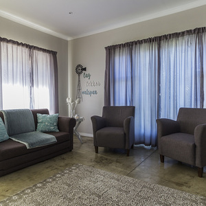 hermanus_accommodation_self_catering_6b_schneider_cottage_sleeper_couch_in_open_plan_living_room_1563455698_1563459730
