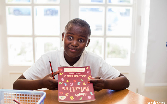 Butterfly_centre_butterfly_boy_showing_off_his_new_math_workbook_1528900935_1571308499