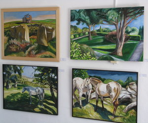 Photo of a wall of paintings
