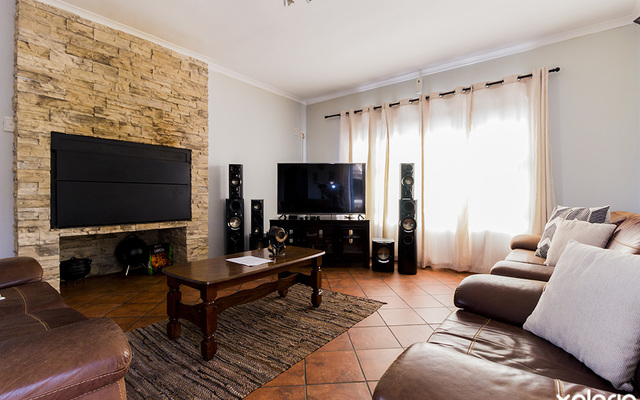 gansbaai_accommodation_the_blue_tuscan_villa_living_room_with_tv_1565946595_1595247362