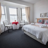 agulhas_guesthouse_cape_agulhas_guest_house_red_and_blue_bedroom_1544521309_1601043918