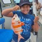 Boy Enjoying Boat Angling Trip - Awesome Charters - Agulhas/Struisbaai Boy Enjoying Boat Angling Trip - Awesome Charters - Agulhas/Struisbaai