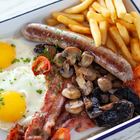 Xplorio™ Struisbaai - Catch Cook Restaurant - Skippers Breakfast (two free range eggs served with bacon, local beef boerewors, sautéed mushrooms, roasted cherry tomato’s and chips *bacon can be substituted with macon)