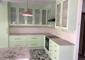 Kitchen with Granite Tops and Pistachio Green Doors and Panels