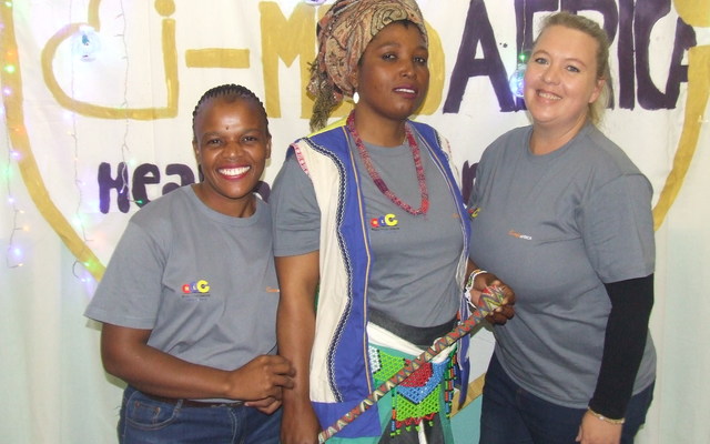 Zokhanya Bikani, student Nangamso Nojaja (in a traditional dress) and Gretha Hanekom.