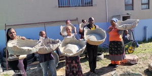 Practical workshop, students making cement pots for container planting.