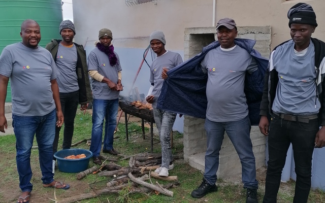 Students around the fire, celebrating afterwards.