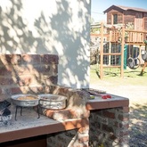 Outside Braai & Kiddies Play Area - Happy Family Guesthouse - Xplorio™ Gansbaai 